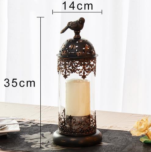 Decorative candle holder with bird design and measurements on a white background