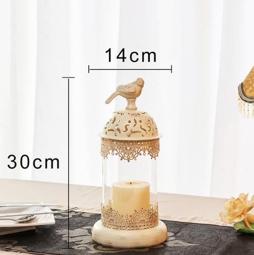 Decorative candle holder with bird design and measurements on a white background