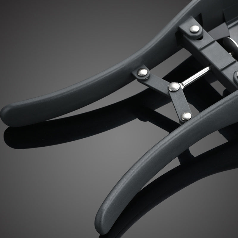 Close-up of a black metal bike rack on a gray background