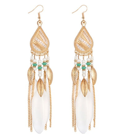 Gold-framed earrings with white stones, green beads, and leaf designs on a white background
