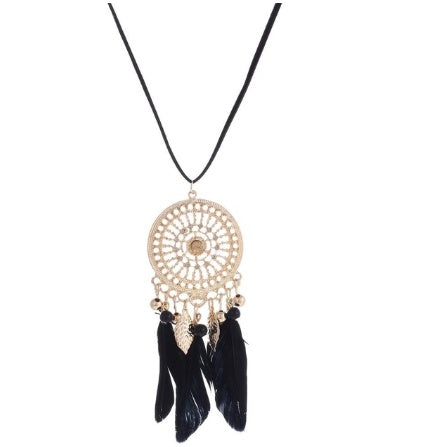 Dreamcatcher necklace with black feathers on a white background
