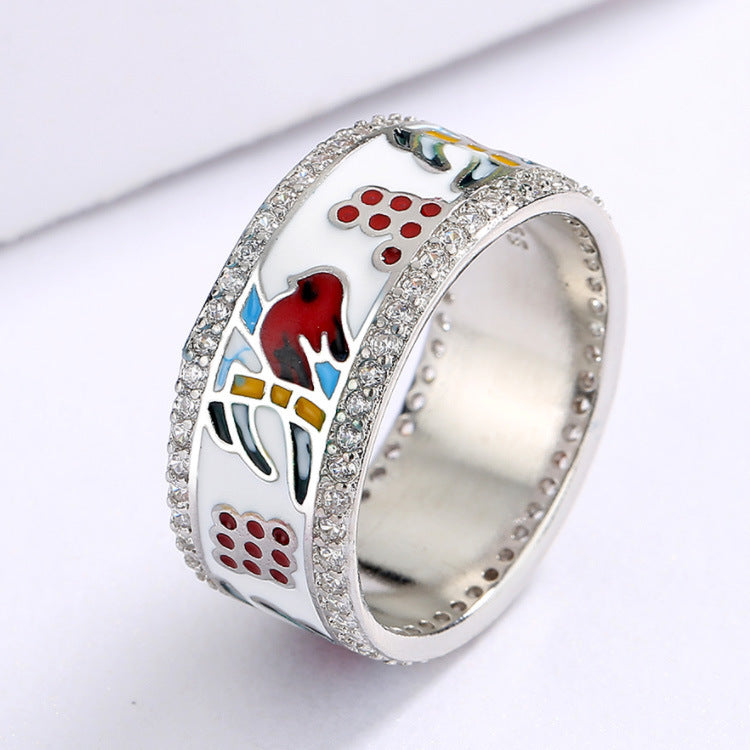 Silver ring with colorful design on a white background