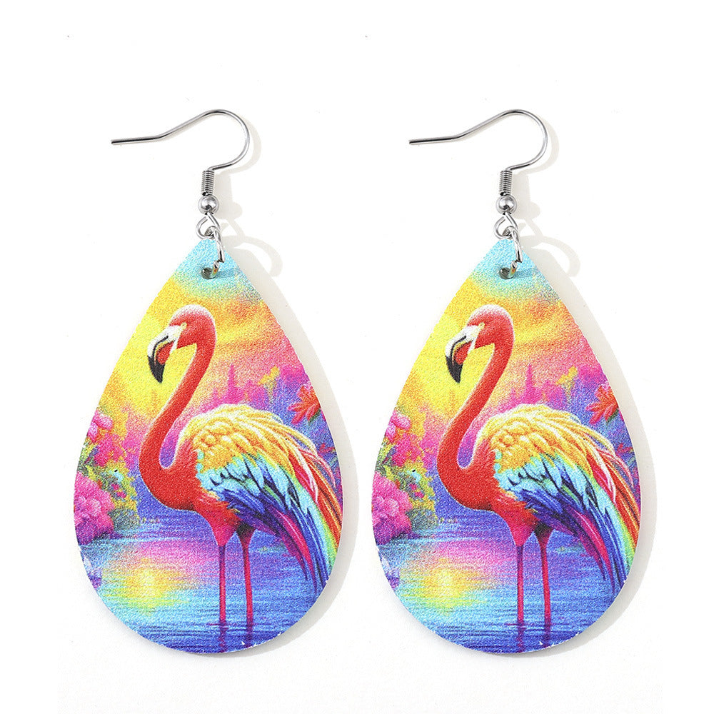 Teardrop-shaped earrings with colorful flamingo design on a white background