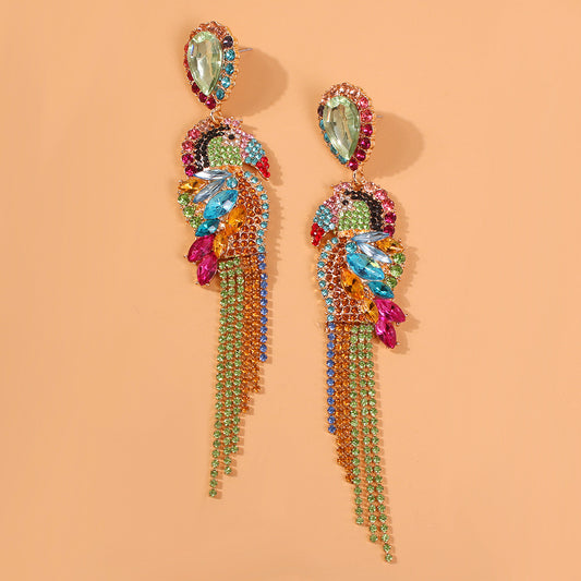 Colorful beaded earrings on a peach background