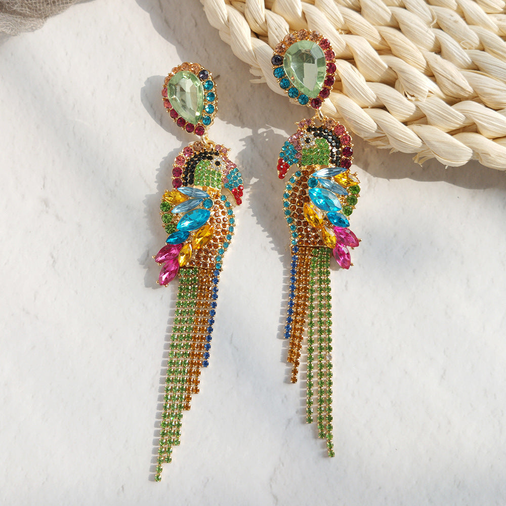 Colorful gem stone earrings on a textured surface