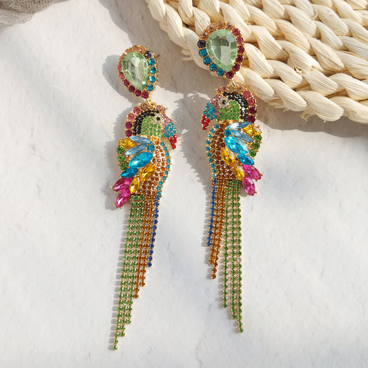 Colorful gem stone earrings on a textured surface