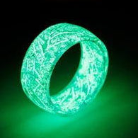 Glowing green ring with 'Tropical Paradise' logo above on a dark background
