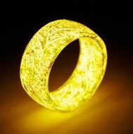 Neon sign of a pineapple with 'Night Pineapple' text on a dark background