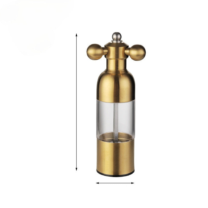 Gold salt and pepper shaker set on a white background