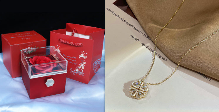Red jewelry box with a rose and gold necklace on a white surface