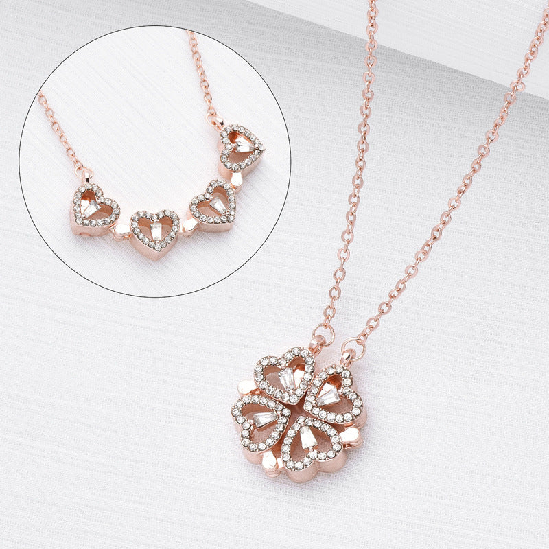 Rose gold necklace with heart-shaped pendant on a white background