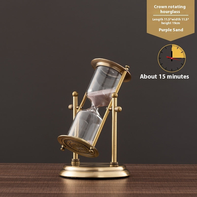 Gold hourglass with purple sand on a dark background