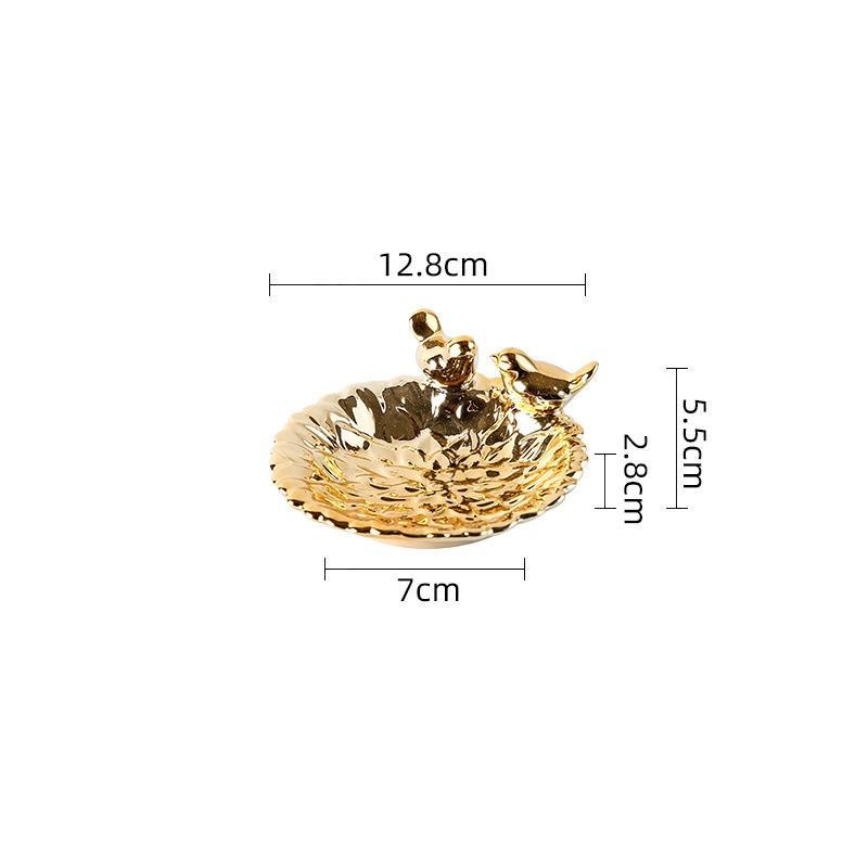 Gold bird nest with two birds on a white background with measurements indicated.