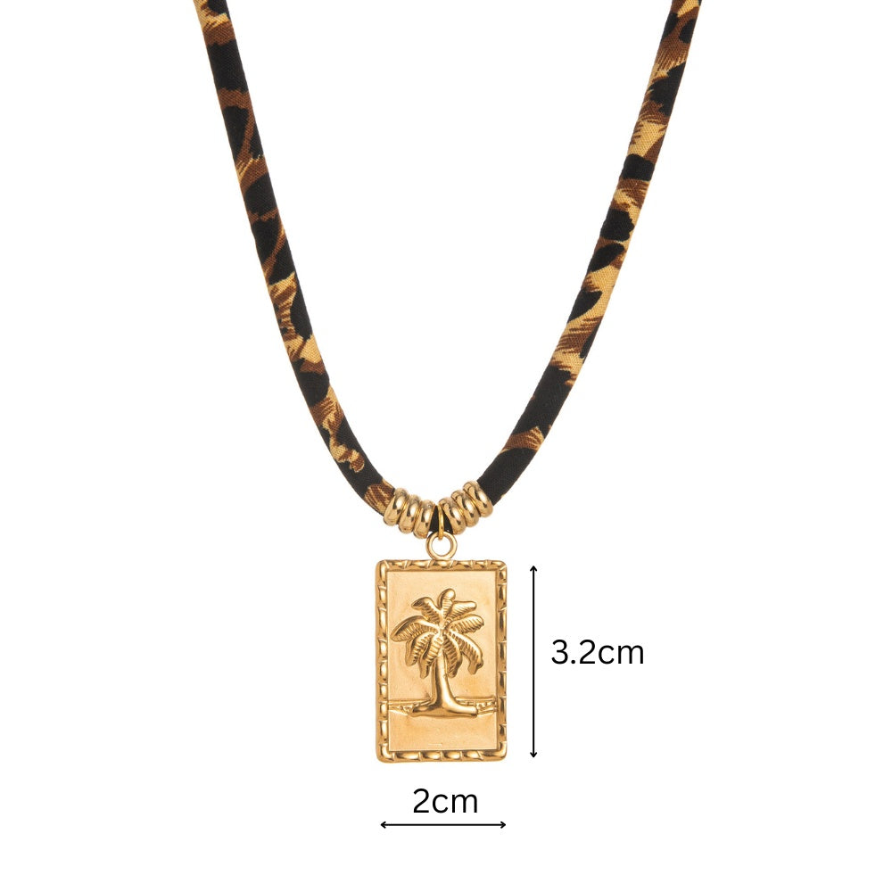 Necklace with a palm tree pendant and tortoiseshell pattern on a white background