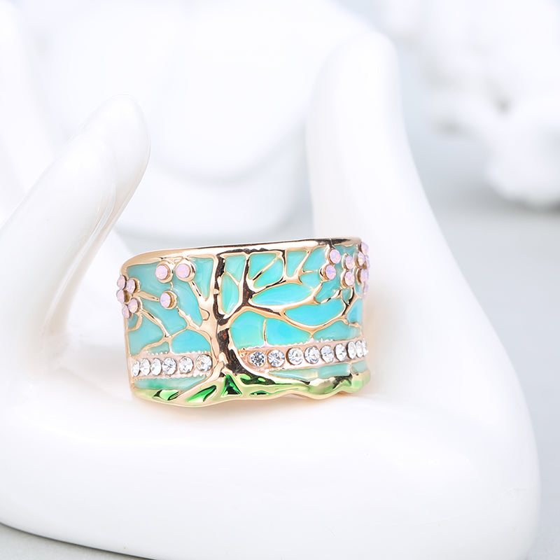 Gold Flower Tree Wide Ring with Green Enamel-Style Inlay on white cloth
