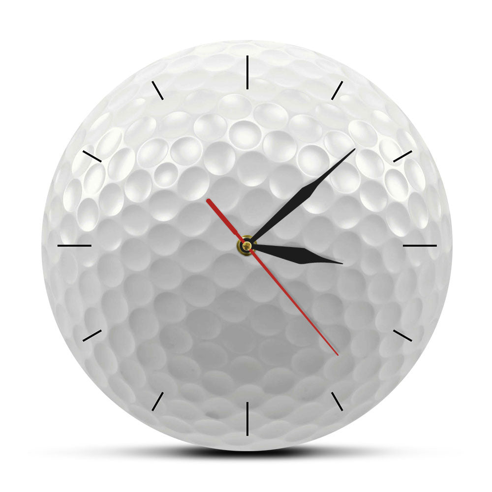Golf ball-shaped clock with black and red hands on a white background