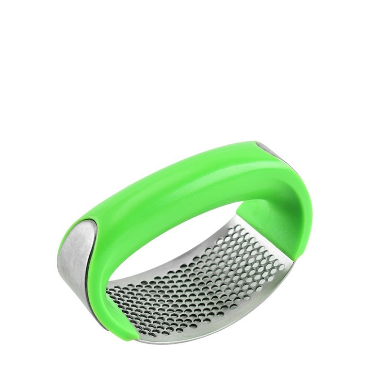 Green handheld grater on a white background