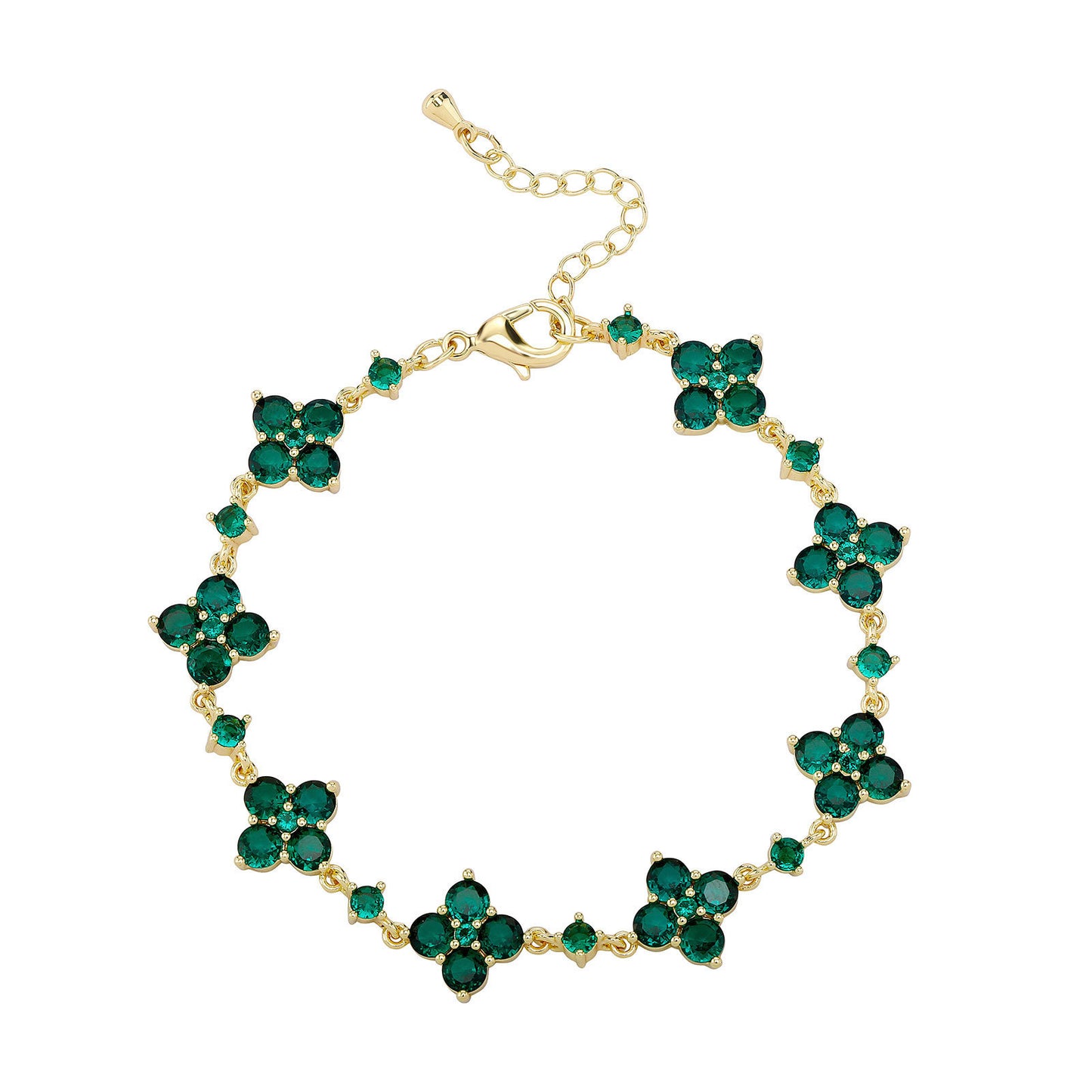 Gold bracelet with green gemstones on a white background