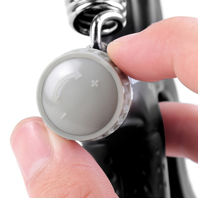 Close-up of a hand holding a gray button with directional arrows on a white background