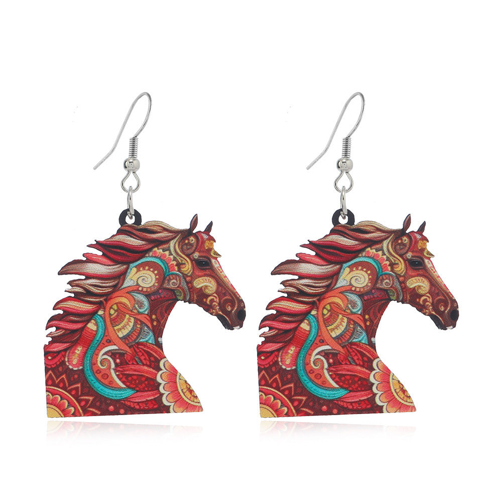 Colorful horse head earrings on a white background