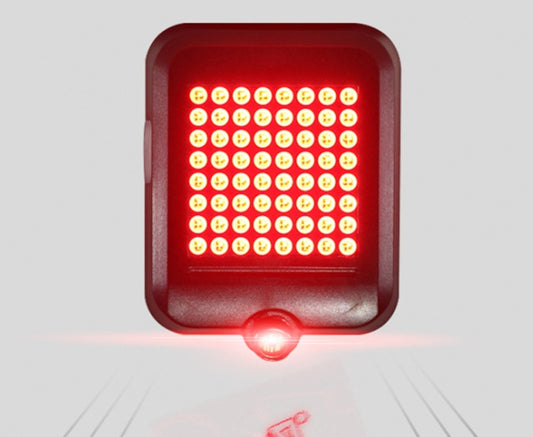 “Square red bike tail light glowing with bright LED matrix close-up”