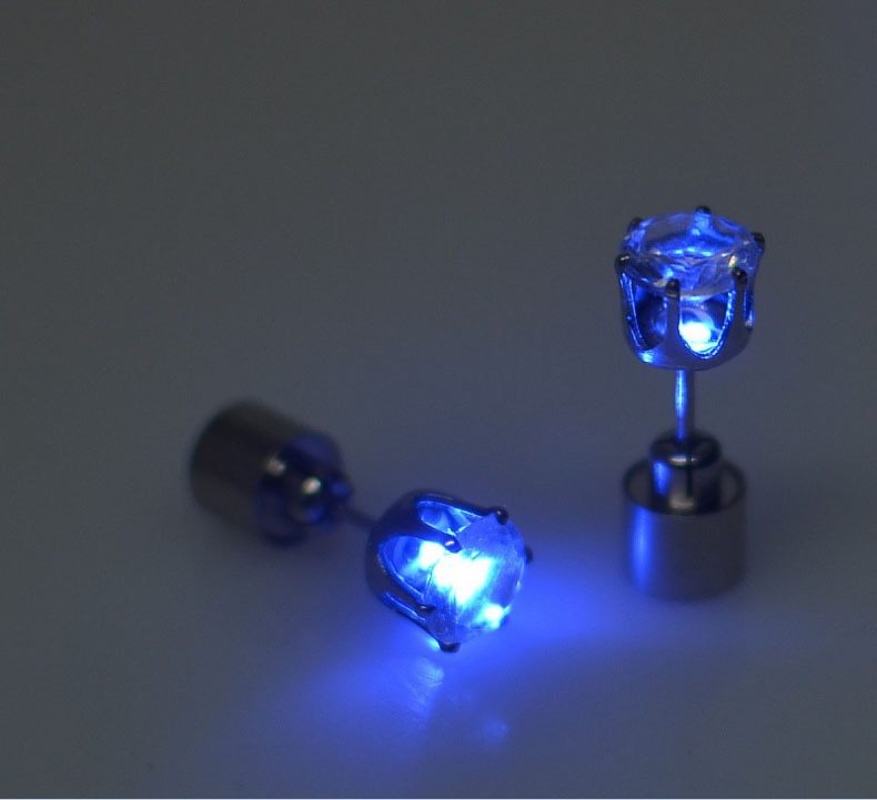 Blue LED stud earrings on a gray background