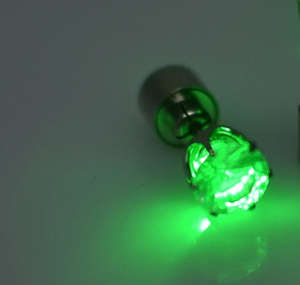 Green LED light bulb on a white background