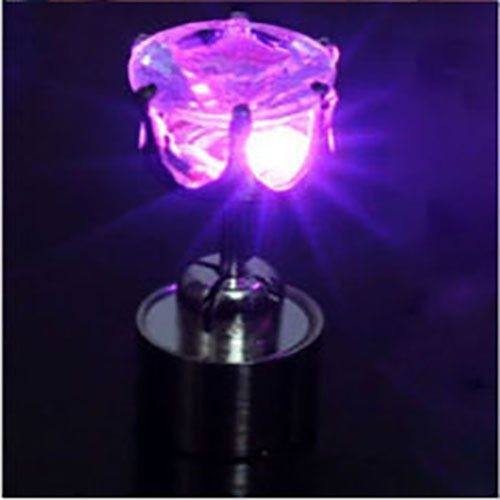 Purple LED light bulb on a dark background