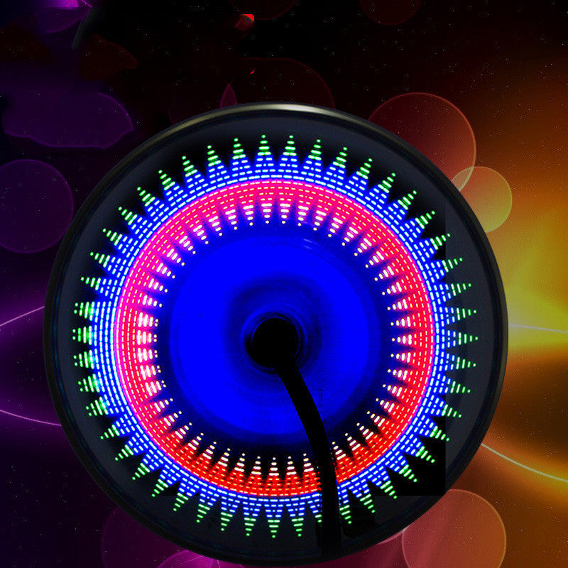 “Close-up of glowing bicycle wheel with rainbow LED spoke lights at night”