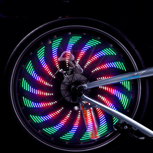 “LED bicycle spoke light creating colorful spiral pattern on spinning wheel”