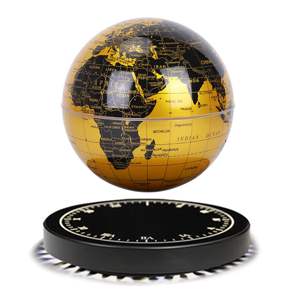 Black and gold world globe on a white background