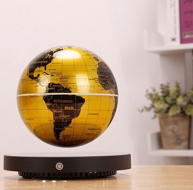 World globe on a wooden surface with a blurred background