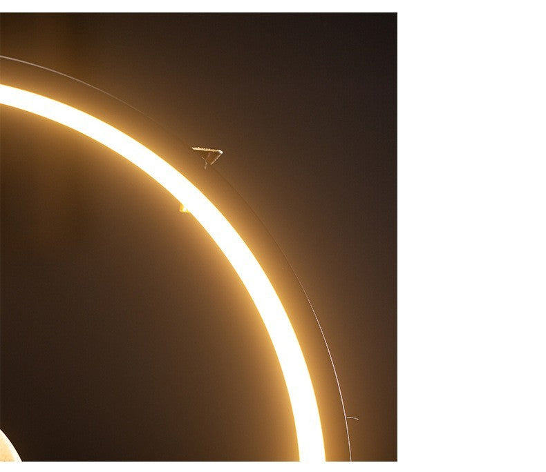 Close-up of a curved surface with a light strip running along its edge.