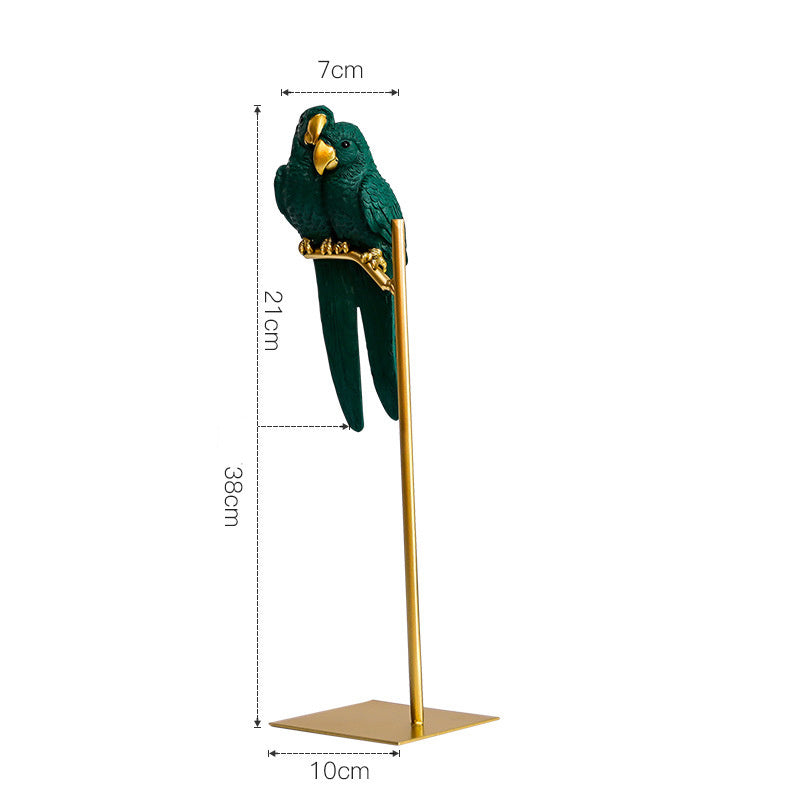 Decorative green parrot figurine on a gold stand with measurements indicated.