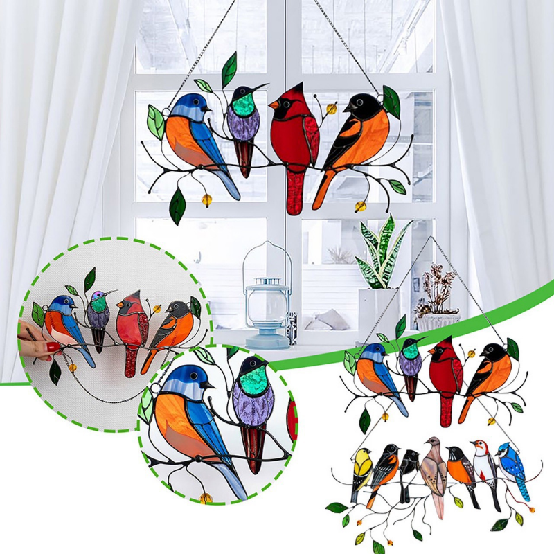 Multiple bird sun catchers hanging in a window