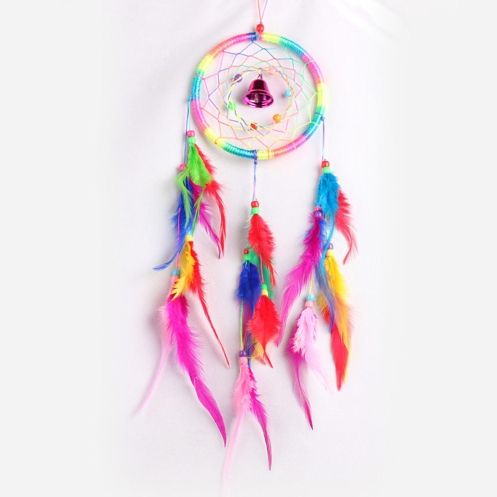Colorful dreamcatcher with feathers on a white background