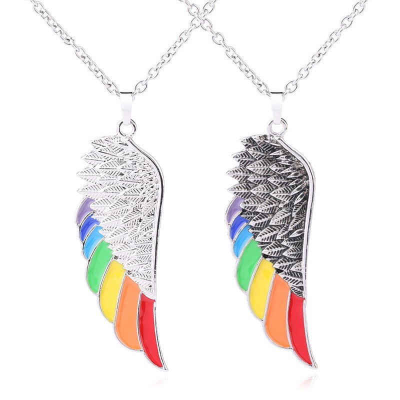 Necklace with angel wing pendants featuring rainbow colors on a white background