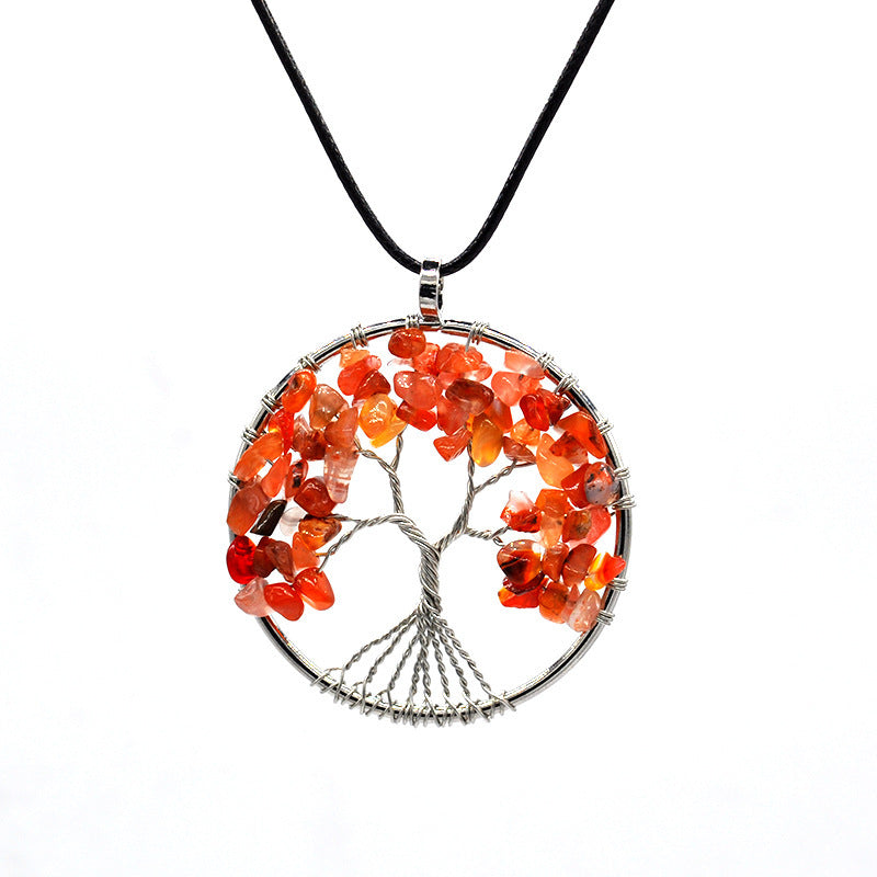 Necklace with a tree-shaped pendant featuring orange stones on a white background