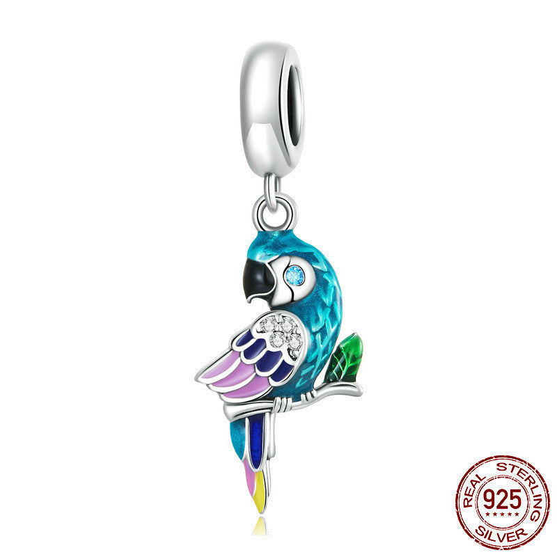 Colorful parrot-shaped charm with a silver ring on a white background, featuring 'Real Sterling Silver' stamp.