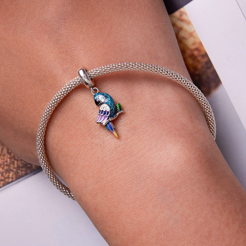 Bracelet with a parrot charm on a wrist
