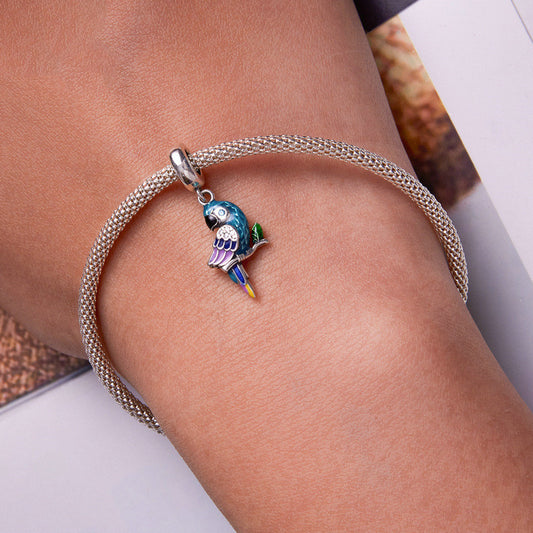 Bracelet with a parrot charm on a wrist