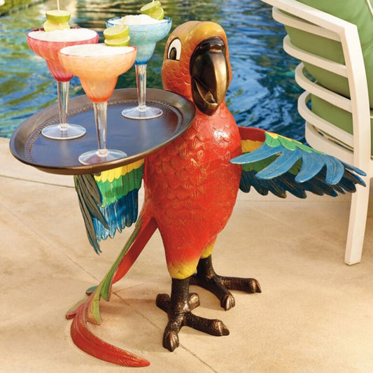 Parrot-shaped table with drinks by a poolside