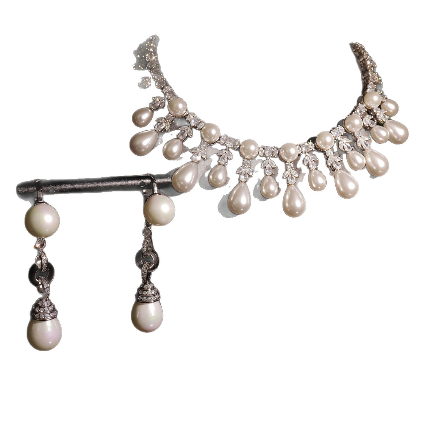 Pearl and crystal necklace on a white background