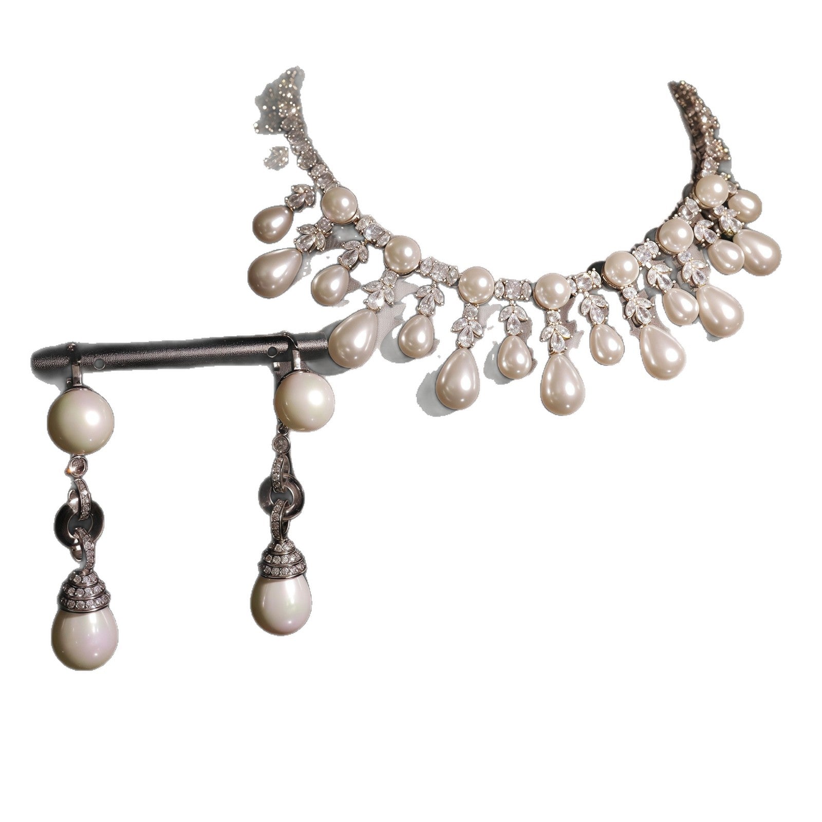 Pearl and crystal necklace on a white background