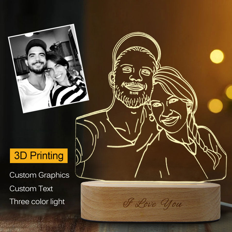 Lighted display of a couple's photo with 'I Love You' engraving on a wooden base.