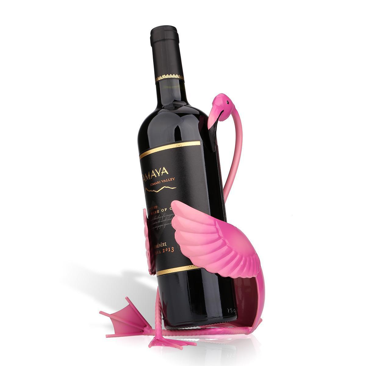 Wine bottle with a pink flamingo-shaped holder on a white background