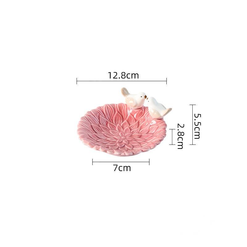 Pink decorative bowl with two birds on a white background, showing measurements.
