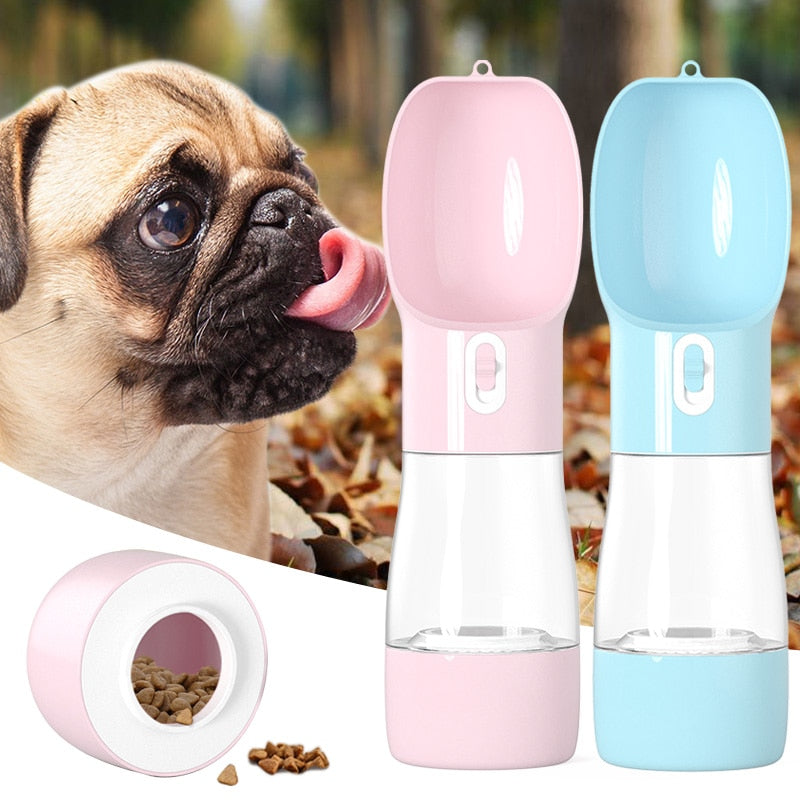 Dog drinking from a pink pet water bottle with a blue lid, surrounded by scattered dog food.