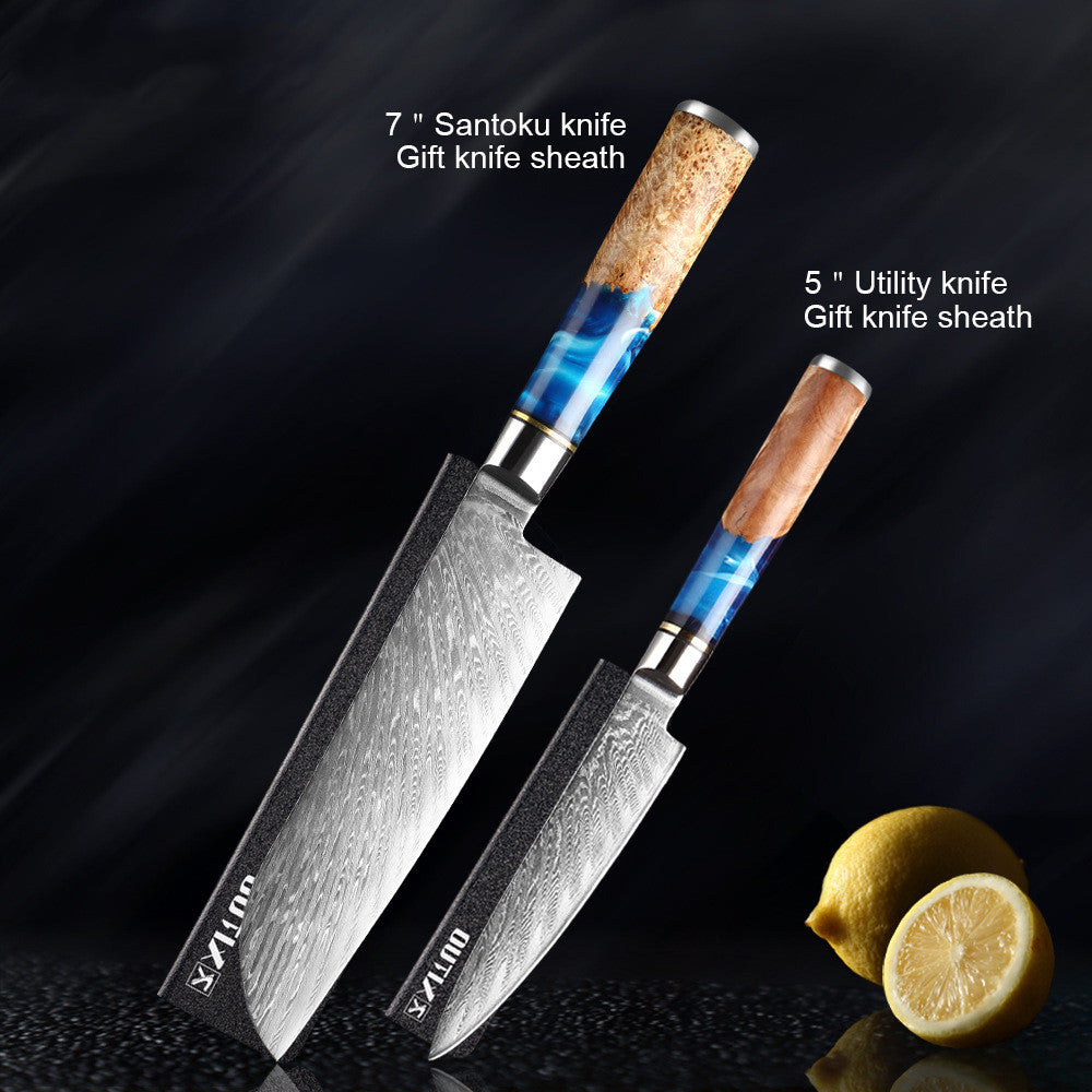 Two knives with sheaths on a dark background with lemons.