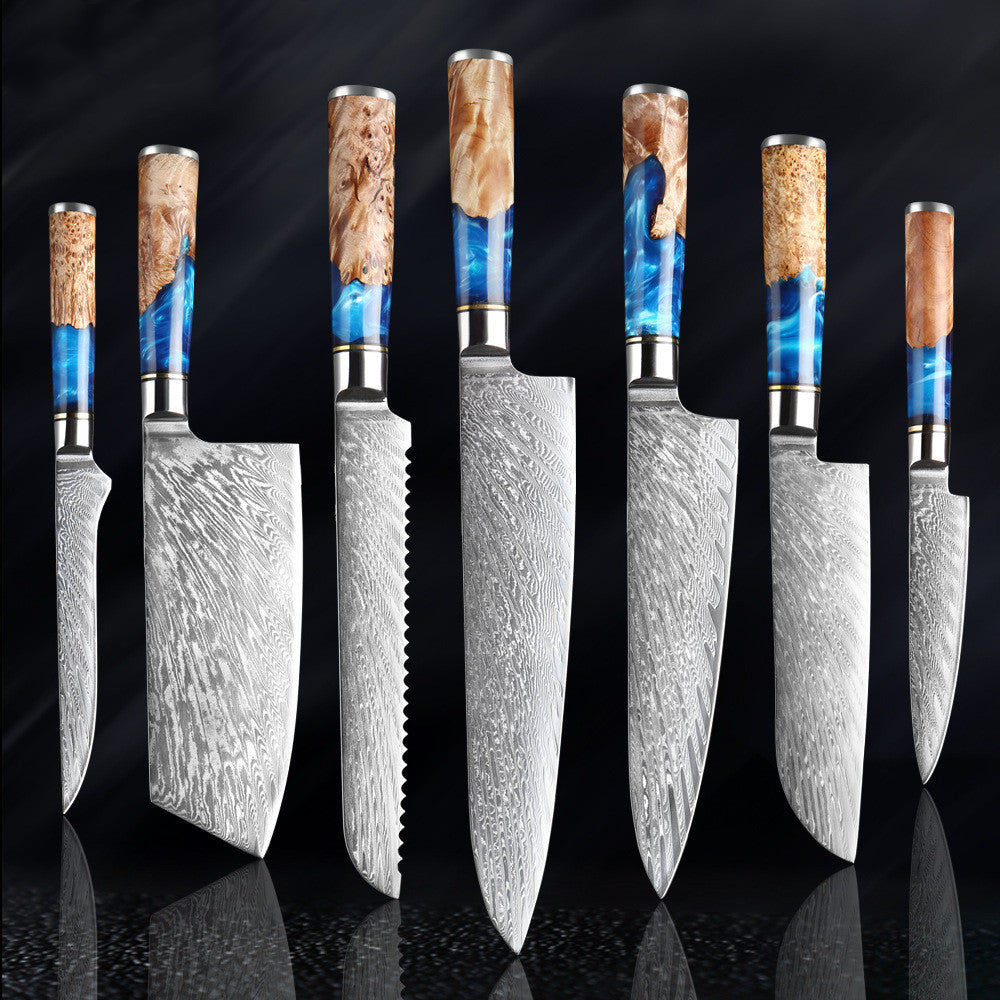 Set of knives with decorative handles on a dark background